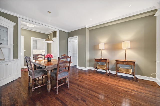 dining area featuring baseboards, ornamental molding, and dark wood-type flooring