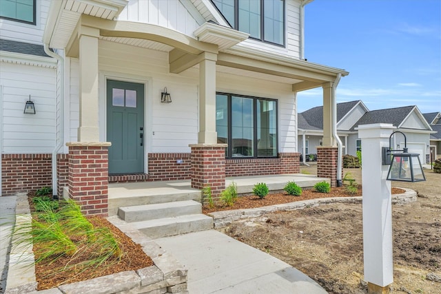 doorway to property featuring covered porch