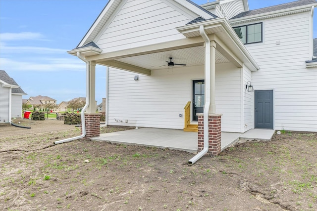 back of property with a patio area and ceiling fan