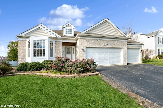 view of front of home featuring a garage and a front lawn