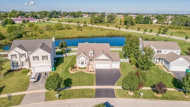 drone / aerial view with a water view