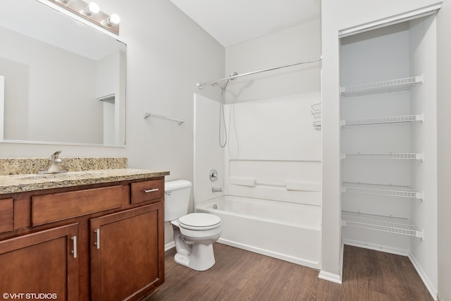 full bathroom with toilet, vanity, wood-type flooring, and shower / bathtub combination