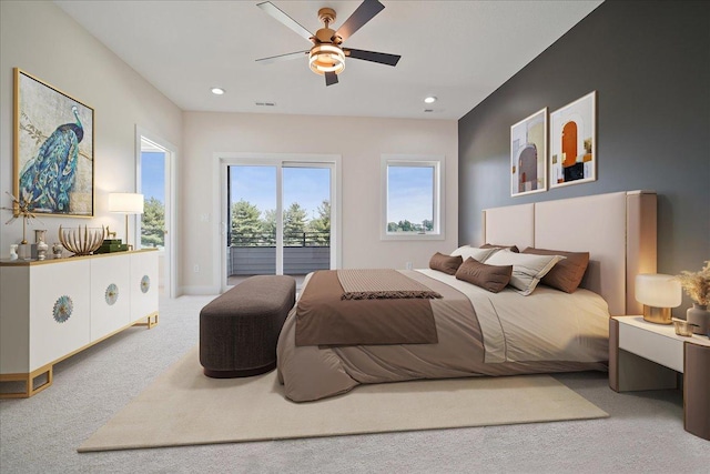 carpeted bedroom with access to exterior and ceiling fan