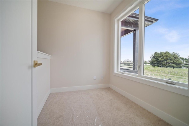 empty room featuring light colored carpet