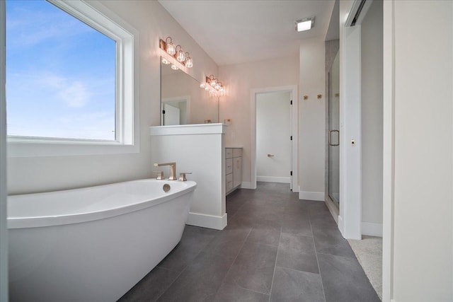 bathroom featuring vanity, tile patterned floors, and shower with separate bathtub