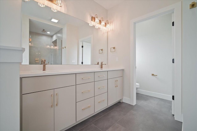 bathroom featuring vanity, toilet, a shower with shower door, and tile patterned flooring