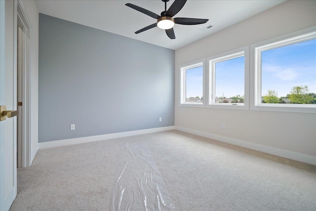 unfurnished bedroom with light colored carpet and ceiling fan