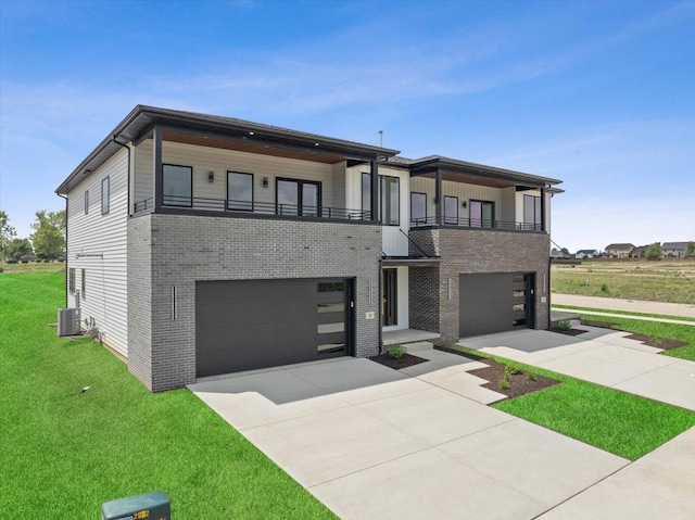 contemporary home featuring a garage, a balcony, central AC unit, and a front lawn