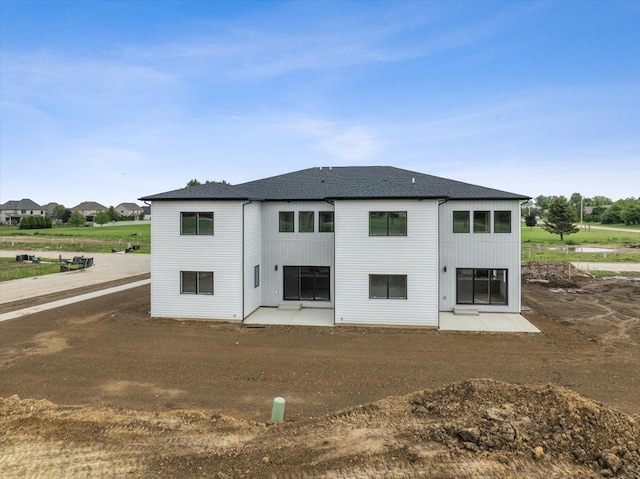 rear view of property featuring a patio area