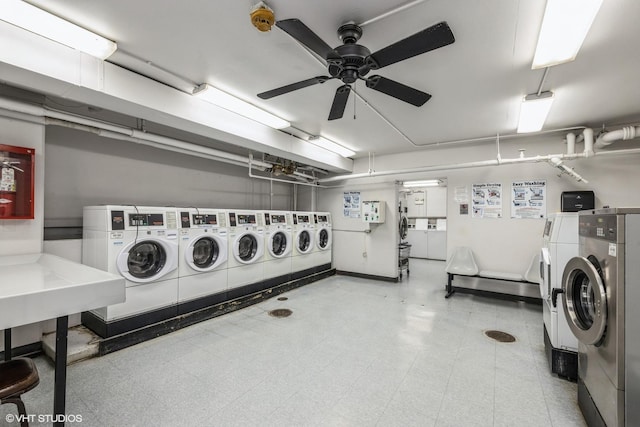 common laundry area with light floors, a ceiling fan, and washing machine and clothes dryer