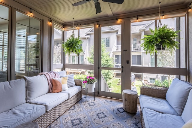 sunroom featuring plenty of natural light and ceiling fan