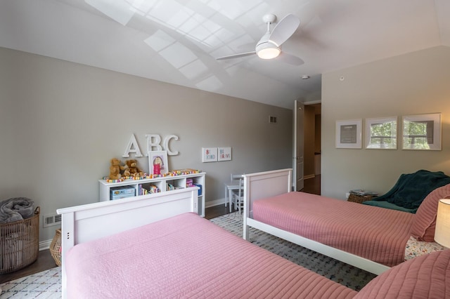 bedroom featuring ceiling fan and vaulted ceiling