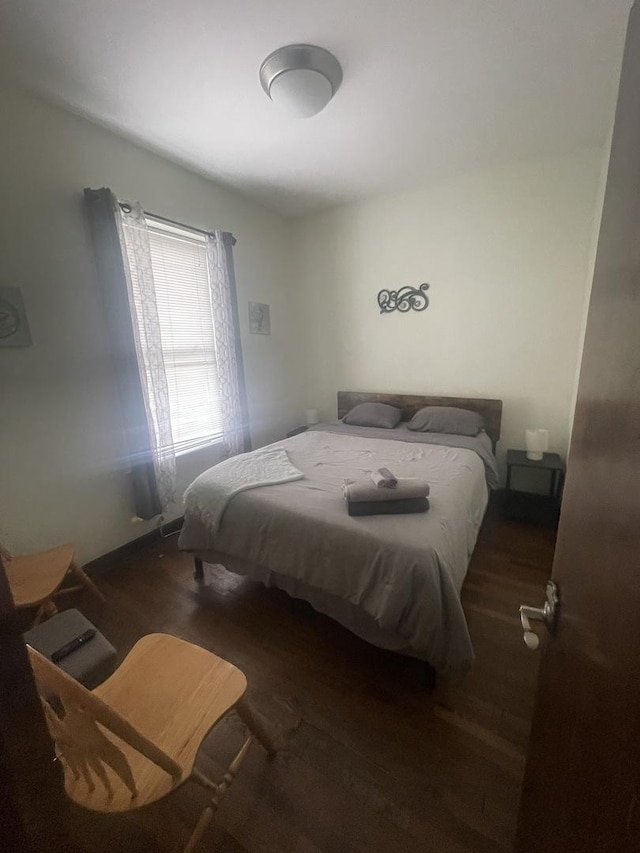 bedroom featuring dark hardwood / wood-style floors