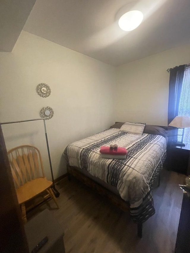 bedroom featuring dark wood-type flooring