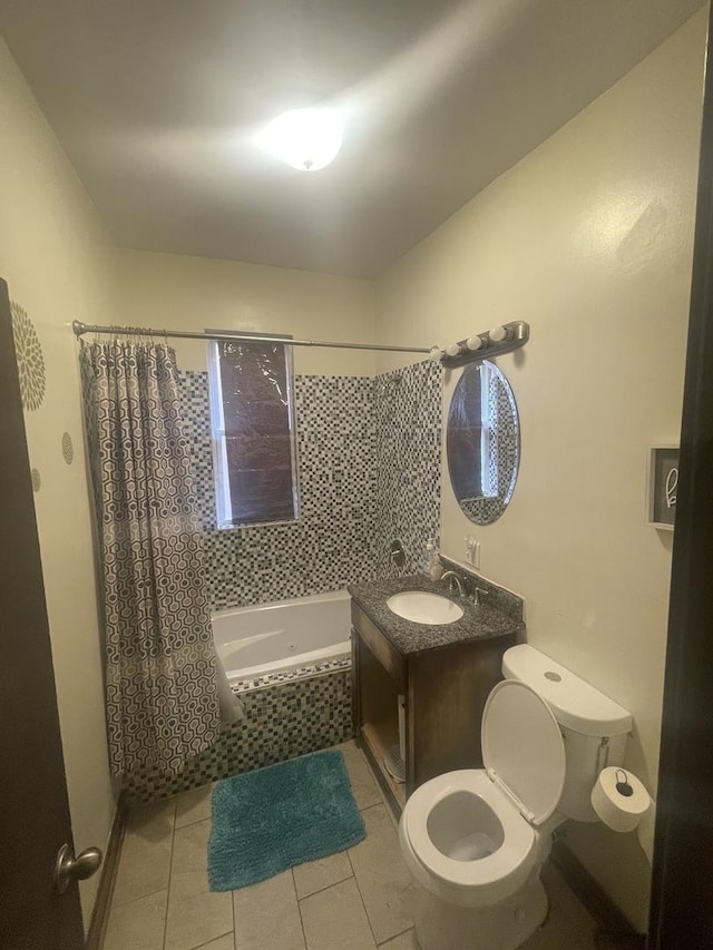 full bathroom featuring shower / bathtub combination with curtain, vanity, tile patterned floors, and toilet