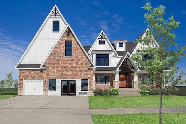 view of front facade with a garage and a front lawn