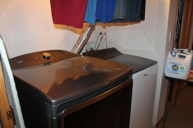 clothes washing area with independent washer and dryer