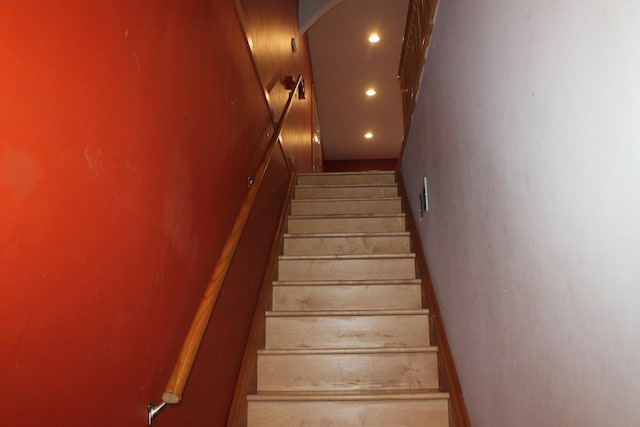 staircase featuring recessed lighting