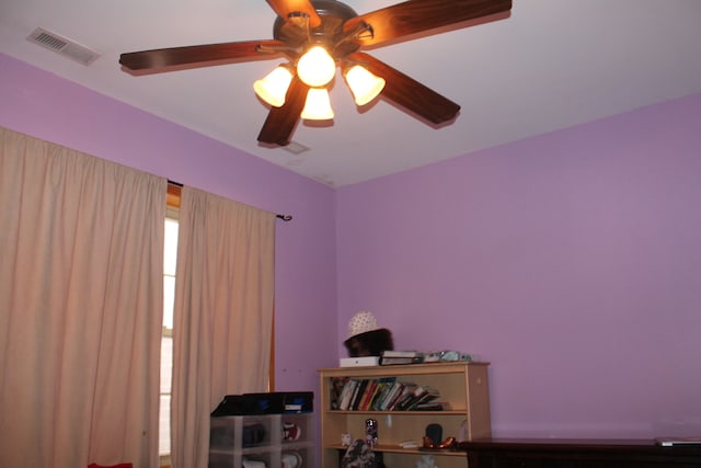 interior space featuring ceiling fan