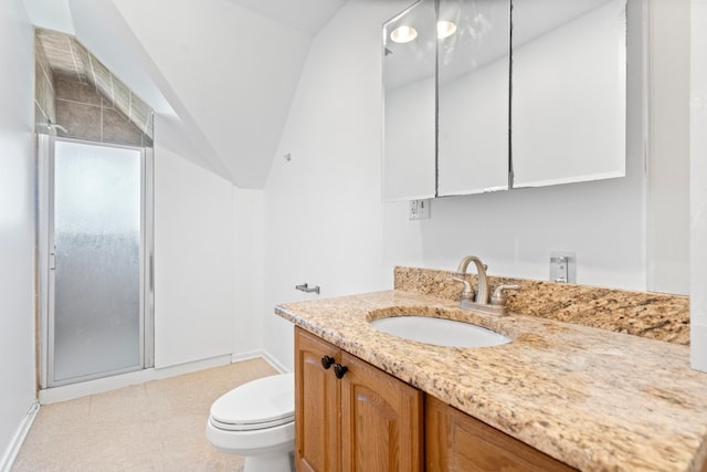 bathroom with vanity, a shower with shower door, lofted ceiling, and toilet