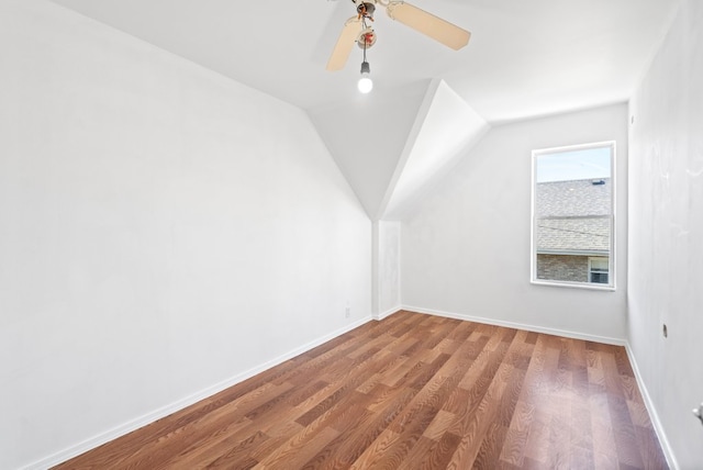 additional living space featuring hardwood / wood-style floors, ceiling fan, and lofted ceiling