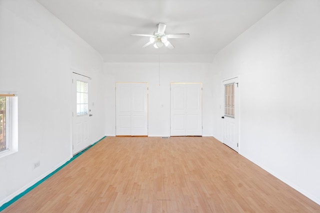 empty room featuring ceiling fan and light hardwood / wood-style flooring