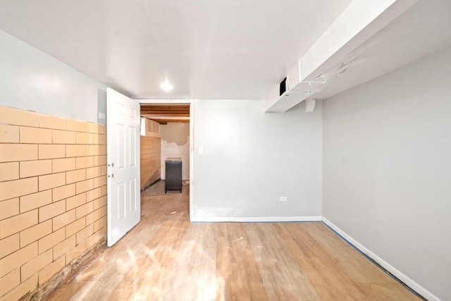 basement featuring light wood-type flooring