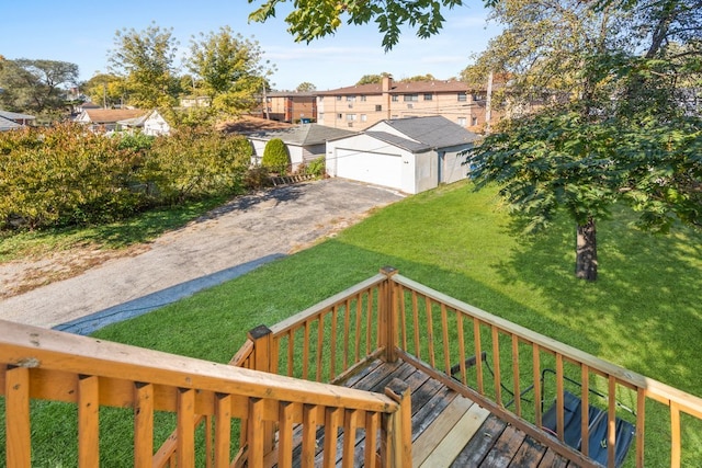 exterior space featuring a wooden deck and a front yard