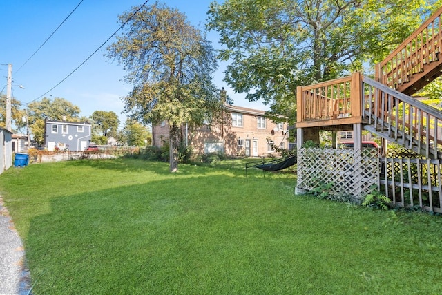 view of yard with a wooden deck