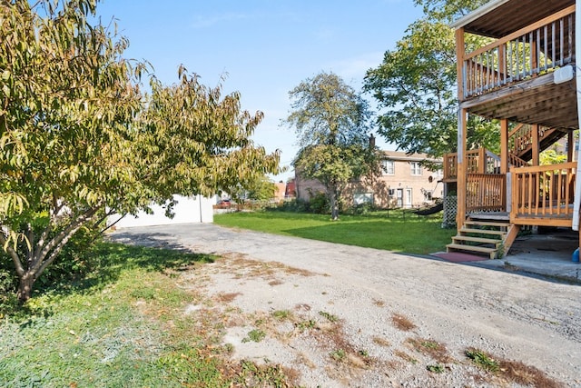 view of yard featuring a wooden deck