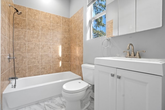 full bathroom with vanity, toilet, and tiled shower / bath