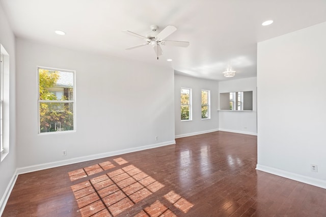 unfurnished room featuring ceiling fan and dark wood-type flooring