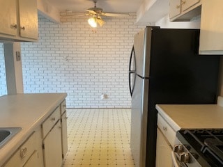 kitchen featuring stainless steel refrigerator and ceiling fan