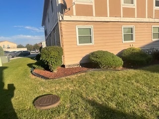 view of side of home featuring a yard