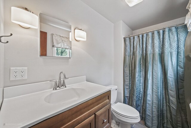 bathroom with vanity and toilet