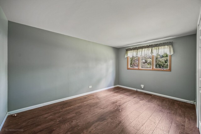 spare room featuring hardwood / wood-style floors