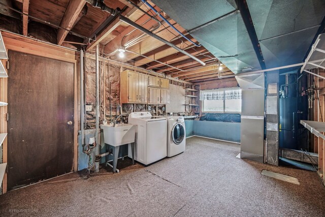 washroom featuring washing machine and dryer and sink