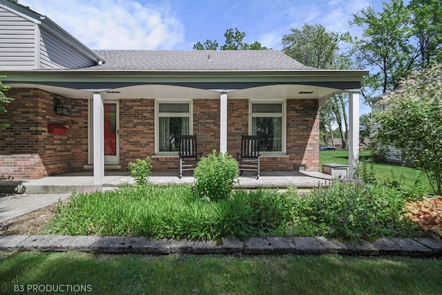 back of house featuring a porch