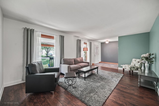 living room featuring dark hardwood / wood-style floors and plenty of natural light