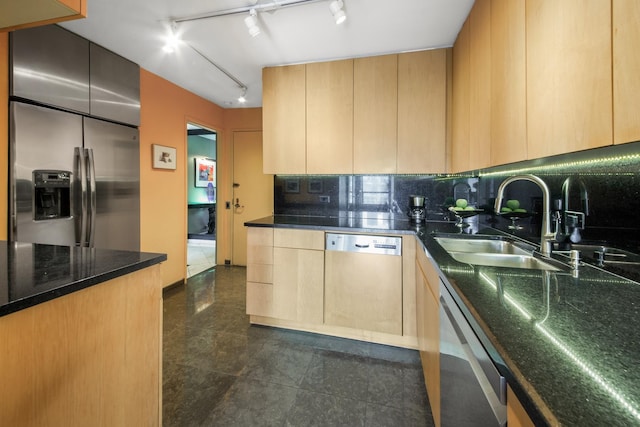 kitchen with dishwashing machine, granite finish floor, stainless steel fridge, and light brown cabinetry