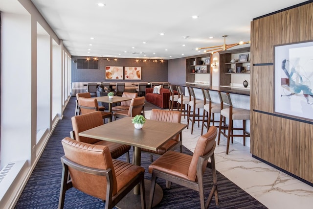 dining room featuring recessed lighting and marble finish floor