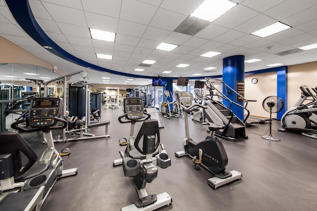 exercise room featuring a drop ceiling