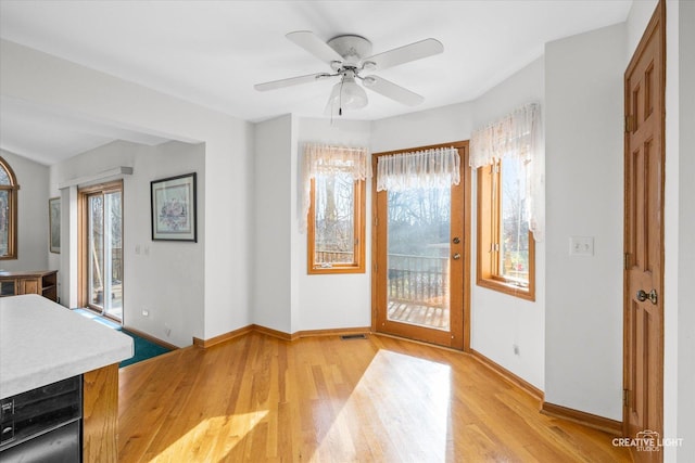 entryway featuring light wood-type flooring and ceiling fan