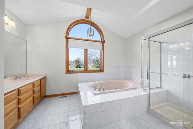 bathroom featuring separate shower and tub, vanity, and vaulted ceiling