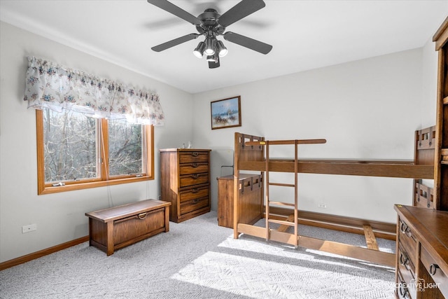 bedroom featuring light carpet and ceiling fan