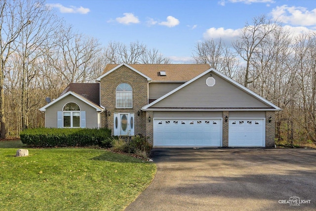 view of front property featuring a garage and a front yard