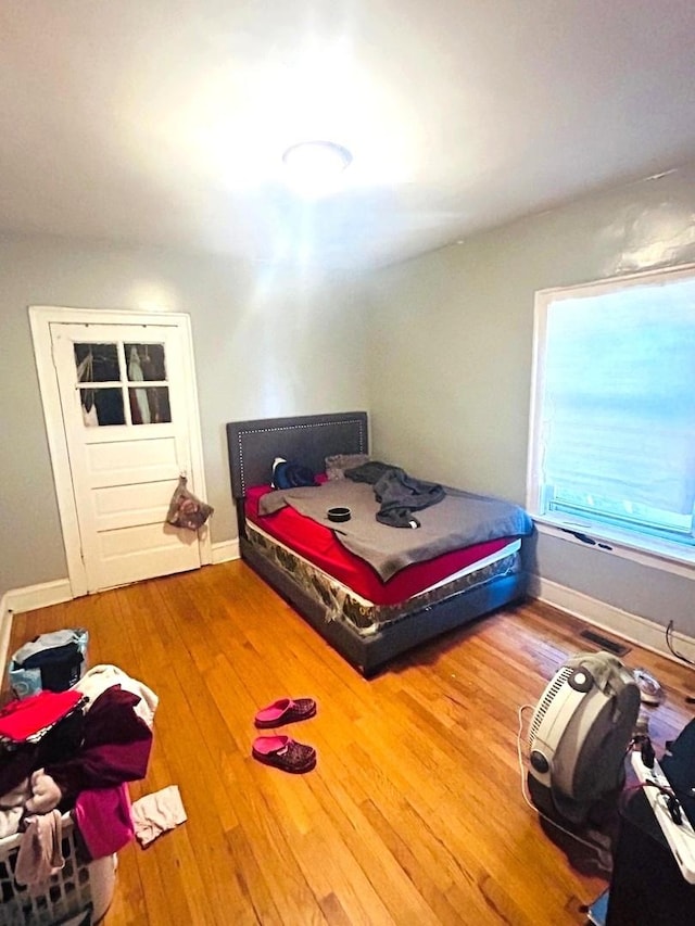 bedroom with wood-type flooring