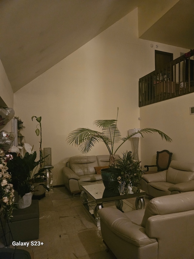 living room with visible vents and high vaulted ceiling