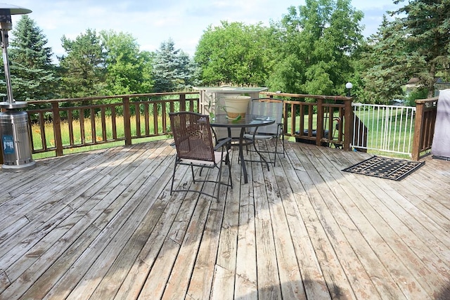 deck with outdoor dining area