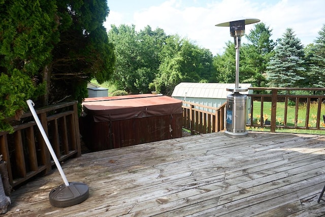 deck featuring a hot tub